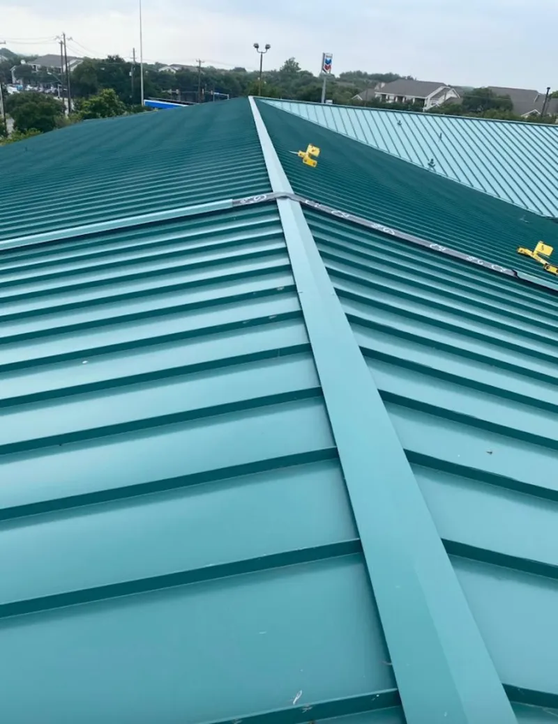 Green commercial metal roof ridge and valley for Metal Roof Repair in Gulf Park Estates